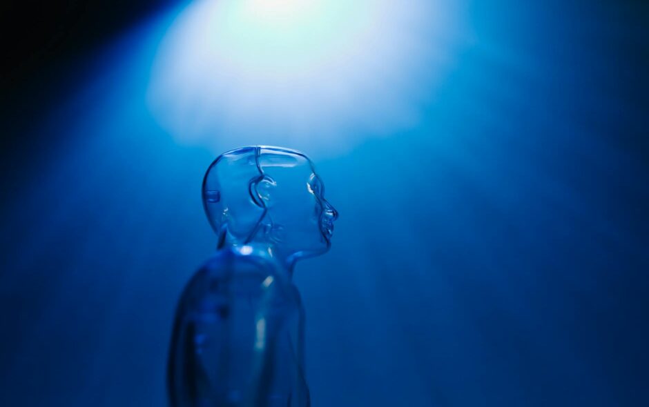 clear mannequin on dark blue background